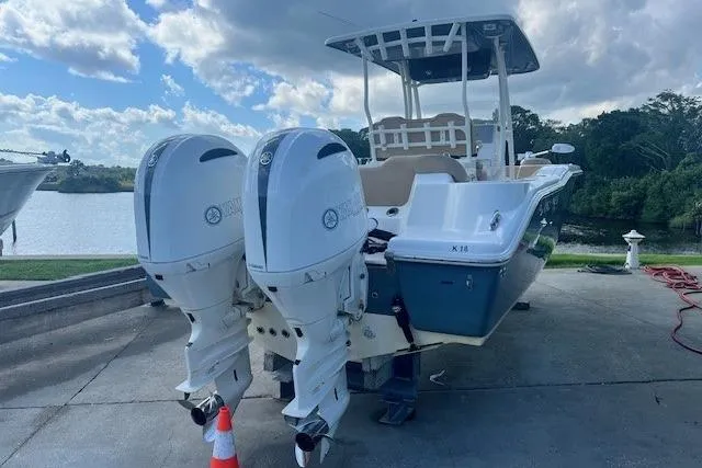 The Image of 2018 Key West 263 FS boat with dual outboard engines on a sunny day. - 0