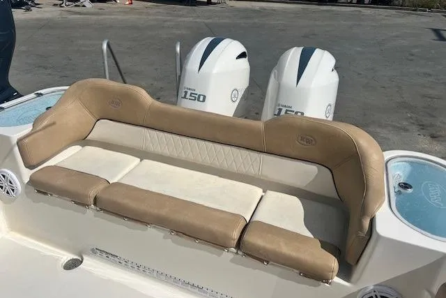 Slide: The Image of 2018 Key West 263 FS boat with dual Yamaha 150 engines and tan seating. - 14
