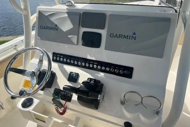 Slide: The Image of 2018 Key West 263 FS boat dashboard with Garmin navigation system and controls. - 4