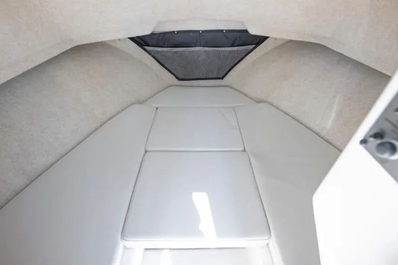 Slide: The Image of Manufacturer Provided Image: Interior cabin of 2025 Parker 2520 XLD Sport Cabin boat with cushioned seating. - 10