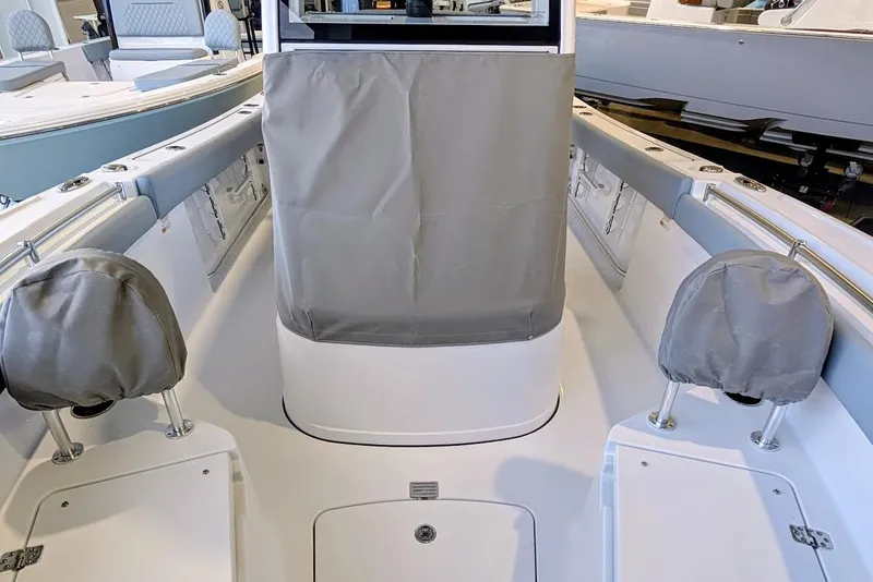 Slide: The Image of 2026 Sportsman Open 212 Center Console boat interior with covered seating and console. - 11