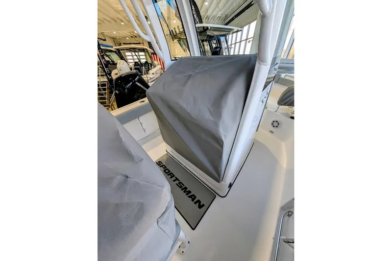 Slide: The Image of 2026 Sportsman Open 212 Center Console boat interior with covered console and seating. - 12
