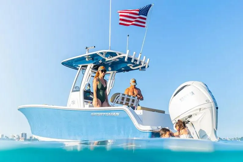 Slide: The Image of 2026 Sportsman Open 212 Center Console with dual seats and steering wheel in showroom. - 2