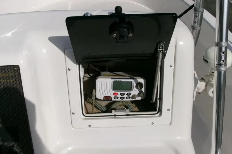 Slide: The Image of 2005 Seaswirl 1851 CC O/B boat console with marine radio compartment. - 12