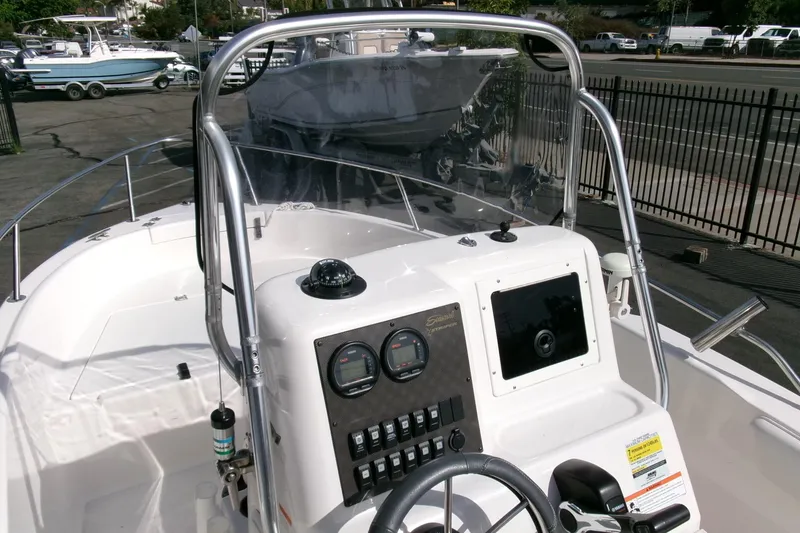 Slide: The Image of 2005 Seaswirl 1851 CC O/B boat dashboard with steering wheel and control panel. - 16