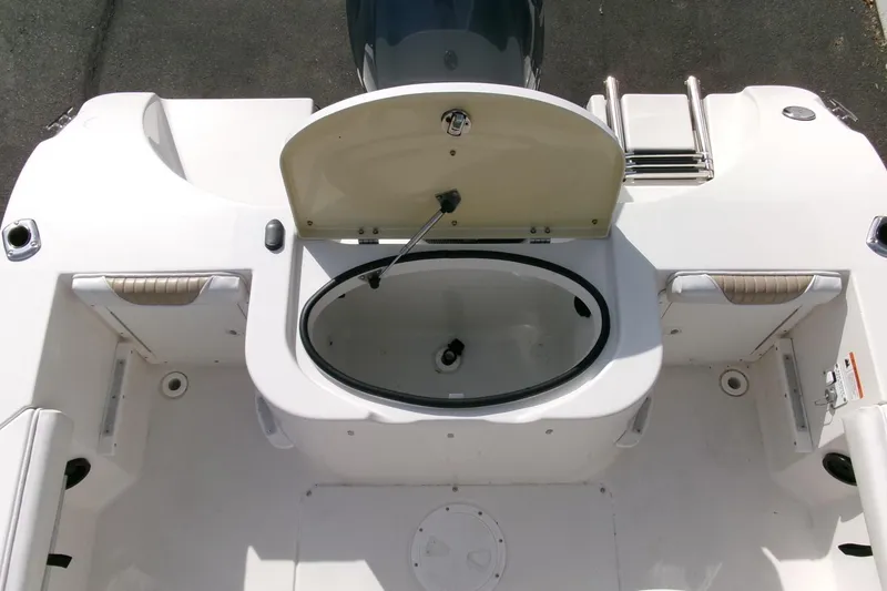 Slide: The Image of 2005 Seaswirl 1851 CC O/B boat interior with open storage compartment and seating. - 22
