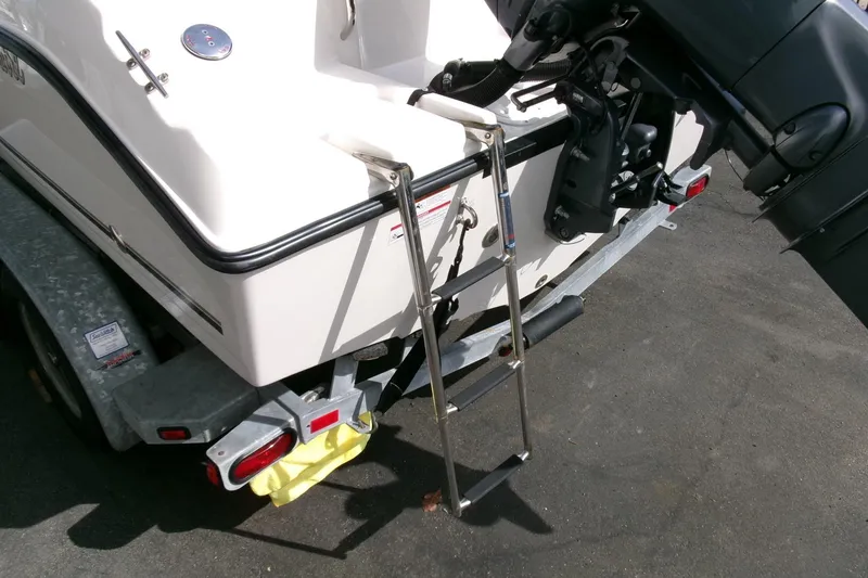 Slide: The Image of 2005 Seaswirl 1851 CC O/B boat on trailer with ladder and outboard motor. - 25