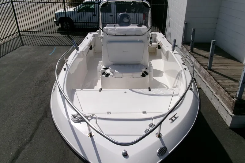 Slide: The Image of 2005 Seaswirl 1851 CC O/B boat, white interior, parked outdoors. - 29