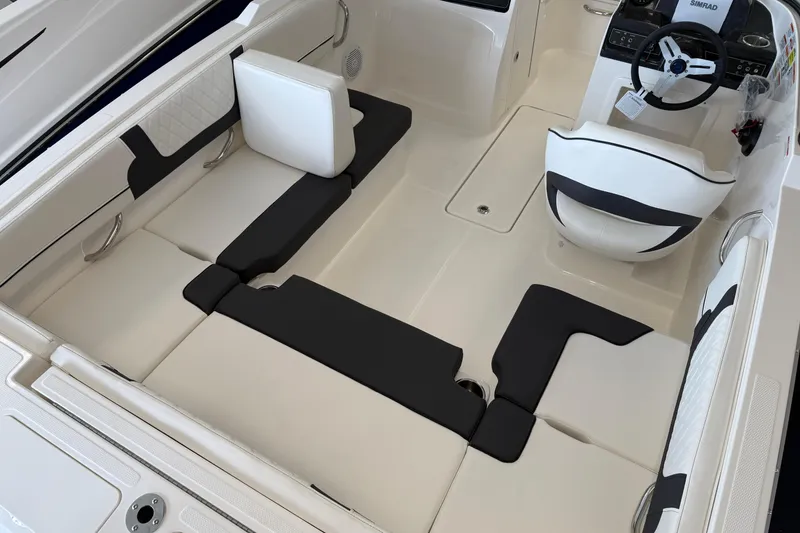Slide: The Image of 2025 Bayliner VR4 Bowrider OB interior with modern seating and steering wheel. - 3