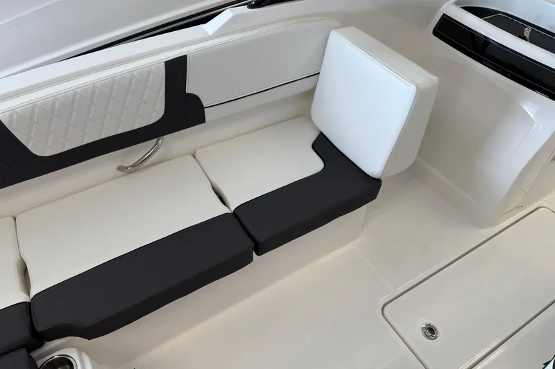 Slide: The Image of 2025 Bayliner VR4 Bowrider OB interior seating with modern black and white design. - 5