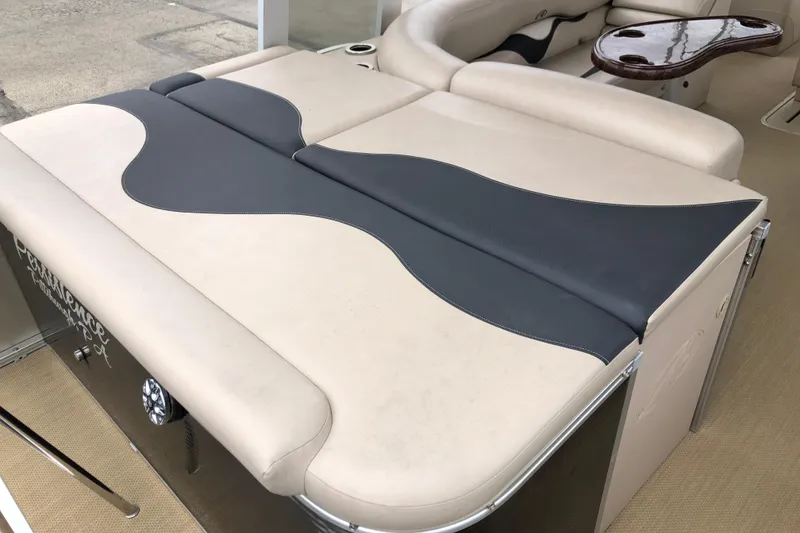 Slide: The Image of 2013 Avalon FUNSHIP 2485 boat interior with beige and gray seating. - 9