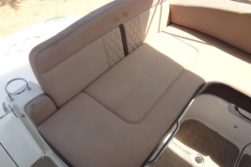 Slide: The Image of Luxurious seating on 2017 Sea Ray Sundancer 280 boat, featuring beige upholstery and elegant design. - 13