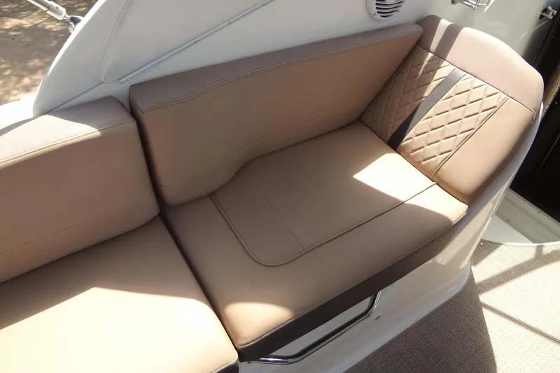 Slide: The Image of Luxurious seating on 2017 Sea Ray Sundancer 280 boat, featuring elegant tan upholstery. - 14