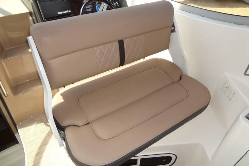 Slide: The Image of 2017 Sea Ray Sundancer 280 boat seat with tan upholstery and diamond stitching. - 18