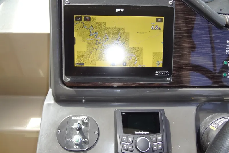 Slide: The Image of Dashboard of 2017 Sea Ray Sundancer 280 with navigation display and controls. - 21