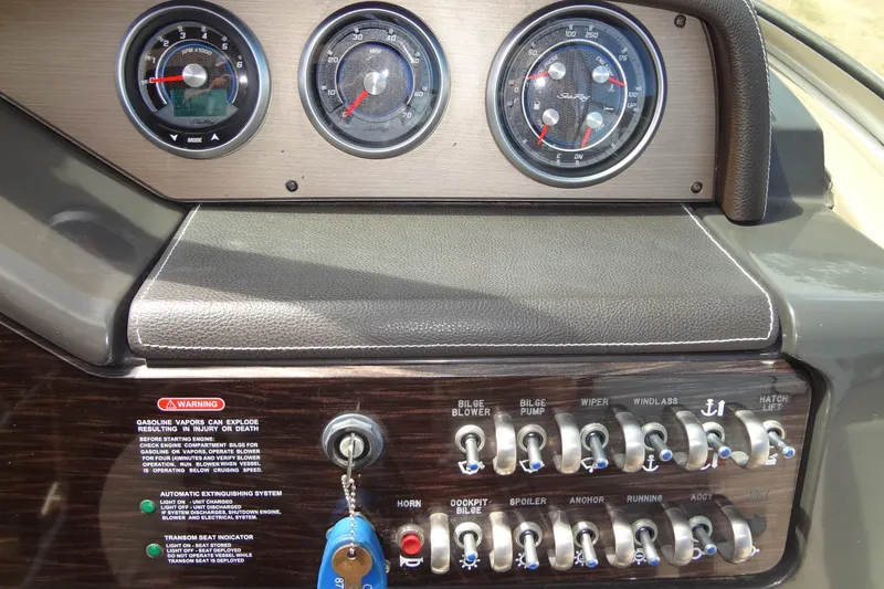 Slide: The Image of Dashboard of 2017 Sea Ray Sundancer 280 boat with gauges and control switches. - 23