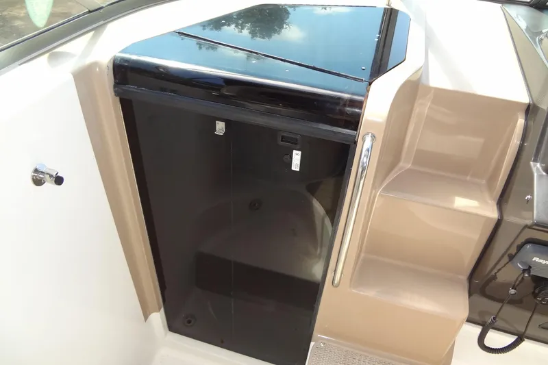 Slide: The Image of 2017 Sea Ray Sundancer 280 cabin entrance with sleek black door and beige steps. - 25