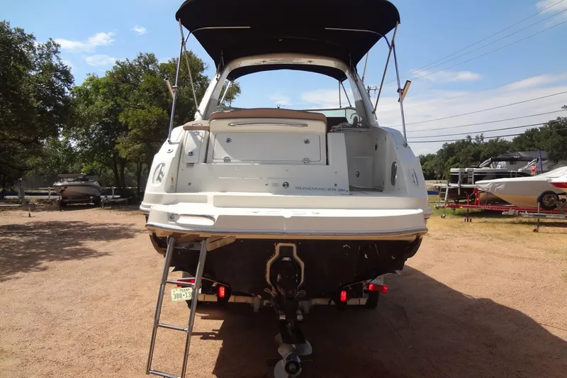 Slide: The Image of 2017 Sea Ray Sundancer 280 boat, rear view, parked on a trailer under a sunny sky. - 3