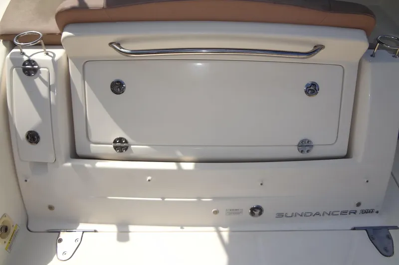 Slide: The Image of 2017 Sea Ray Sundancer 280 boat stern with storage compartment and cup holders. - 40