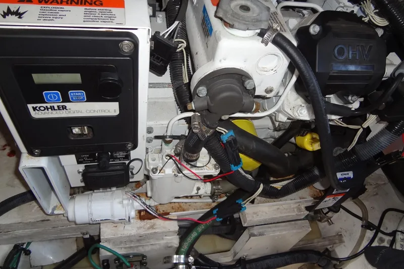 Slide: The Image of Engine compartment of 2017 Sea Ray Sundancer 280 with Kohler digital control panel. - 43