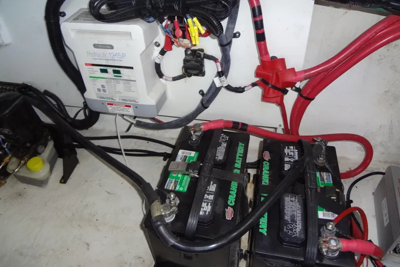 Slide: The Image of Engine compartment of 2017 Sea Ray Sundancer 280 with batteries and wiring. - 45
