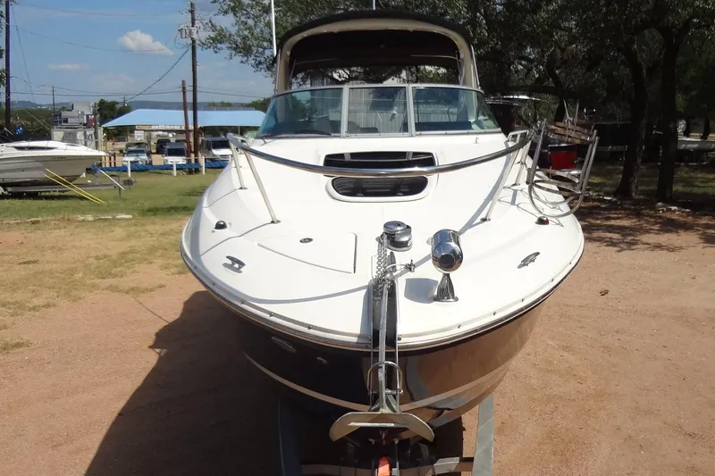 Slide: The Image of 2017 Sea Ray Sundancer 280 boat on display outdoors. - 7