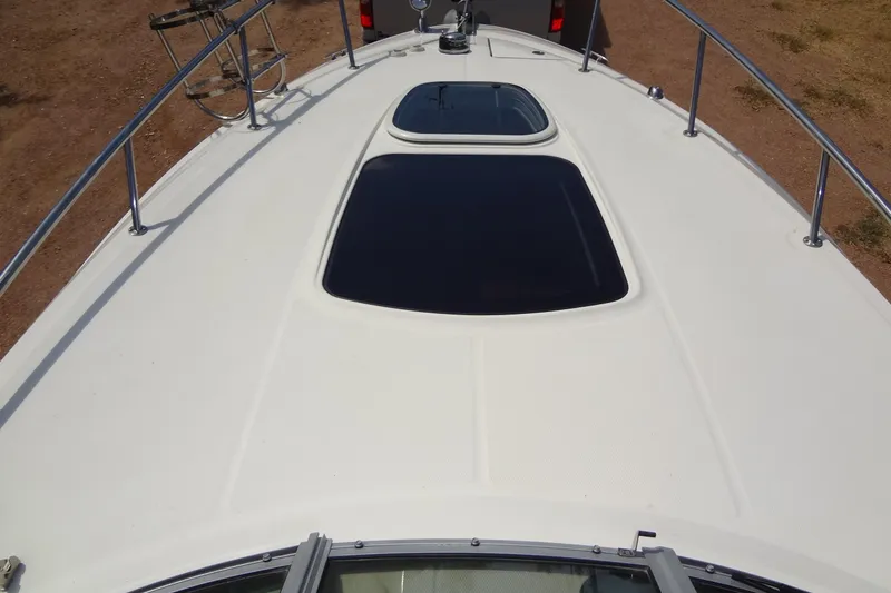 Slide: The Image of 2017 Sea Ray Sundancer 280 boat deck with hatches and railings. - 8