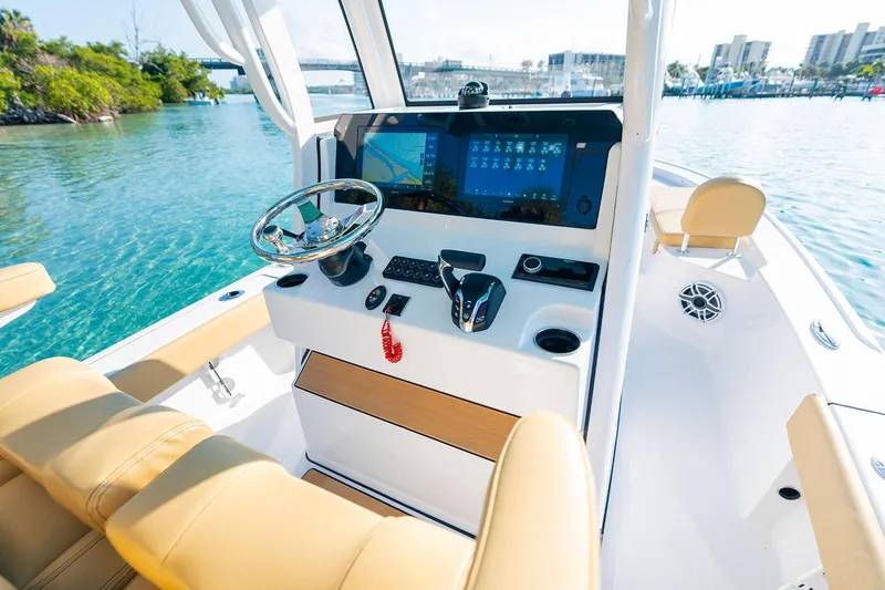 Slide: The Image of 2026 Sportsman Masters 227 Bay Boat displayed outdoors on a concrete surface. - 5