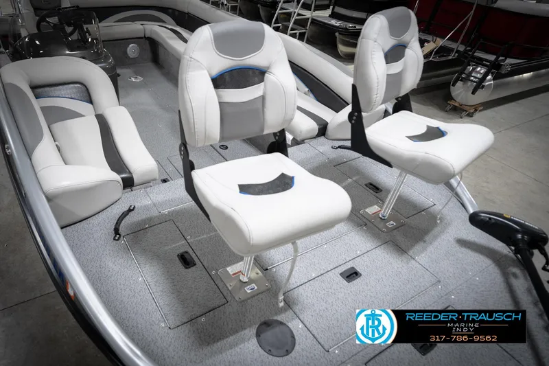 Slide: The Image of Interior of a 2022 Flowers SD224 boat with white cushioned seats. - 11