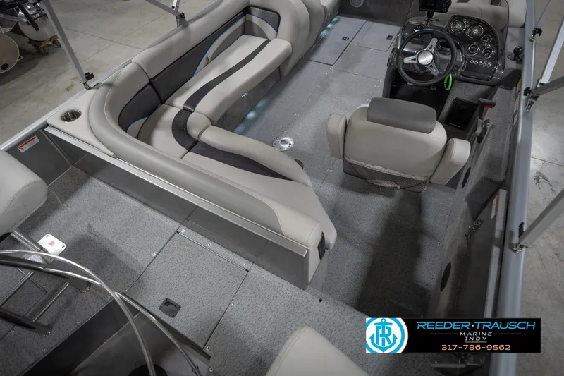 Slide: The Image of Interior of a 2022 Flowers SD224 boat with seating and steering console. - 12