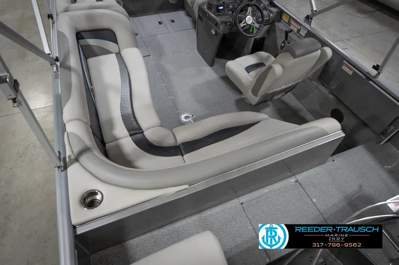 Slide: The Image of Interior of a 2022 Flowers SD224 boat with gray seating and steering console. - 13