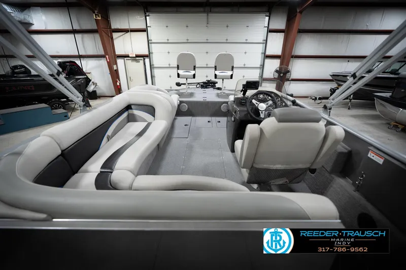 Slide: The Image of Interior view of a 2022 Flowers SD224 boat in a showroom. - 14