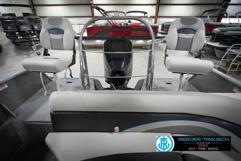 Slide: The Image of Interior of a 2022 Flowers SD224 boat with seating and motor in showroom. - 19