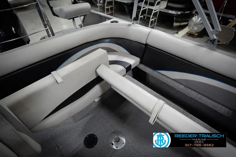 Slide: The Image of Interior of a 2022 Flowers SD224 boat with beige seating and Reeder-Trausch Marine logo. - 22