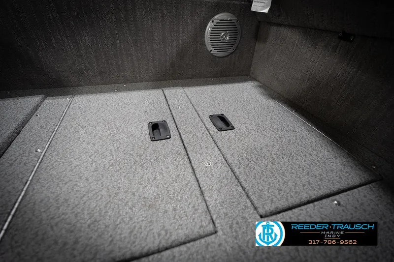 Slide: The Image of Carpeted boat storage compartments with speaker, featuring Reeder-Trausch Marine logo and contact information. - 26