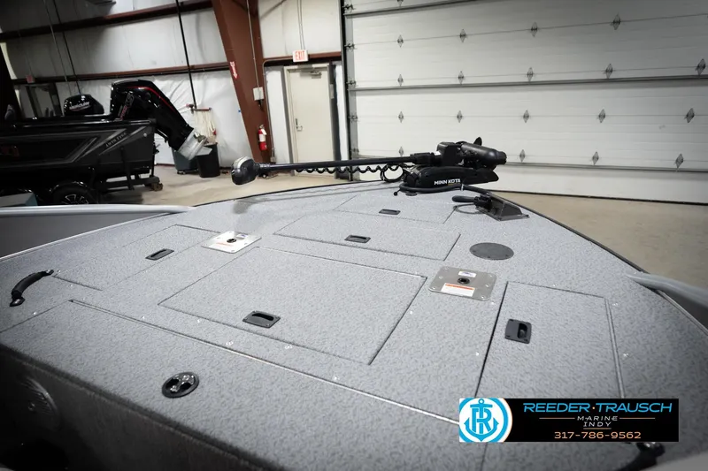 Slide: The Image of Boat deck with Minn Kota trolling motor in a garage, Reeder Trausch Marine logo visible. - 29