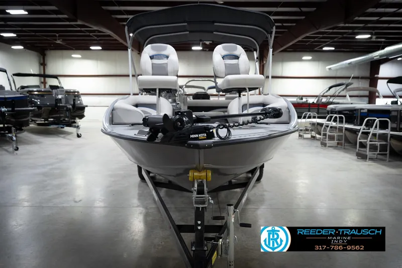 Slide: The Image of 2022 Flowers SD224 boat in showroom, featuring Minn Kota motor, Reeder-Trausch Marine logo. - 3