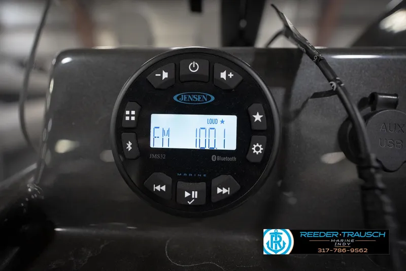 Slide: The Image of Jensen marine radio displaying FM 100.1, featuring Bluetooth connectivity and control buttons. - 34