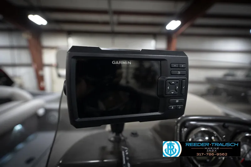 Slide: The Image of Garmin marine GPS device in a boat, Reeder-Trausch Marine logo visible. - 35