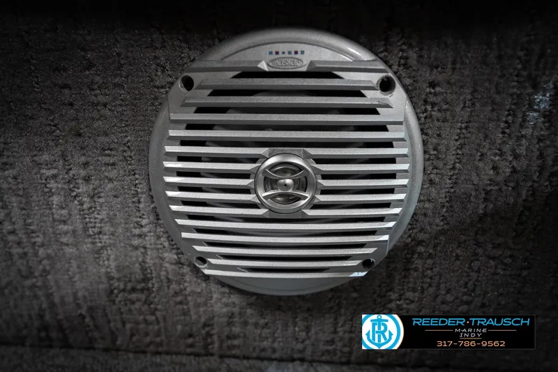 Slide: The Image of Marine speaker on textured surface, featuring Reeder-Trausch Marine logo and contact information. - 51