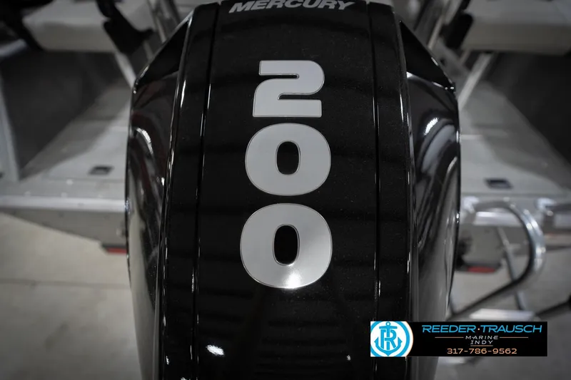 Slide: The Image of Black Mercury 200 horsepower outboard motor, Reeder Trausch Marine logo visible. - 55