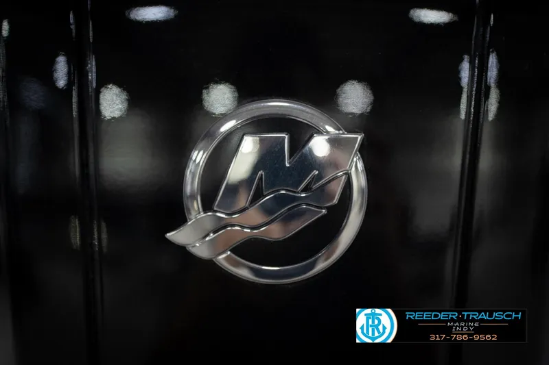 Slide: The Image of Close-up of a metallic logo on a black surface, featuring Reeder-Trausch Marine branding. - 56