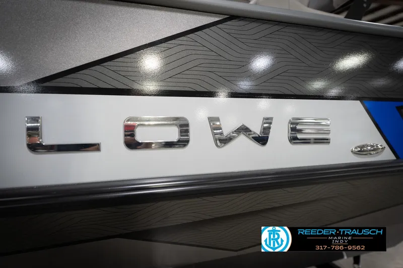 Slide: The Image of Close-up of Lowe boat logo with sleek design and Reeder-Trausch Marine contact details. - 57