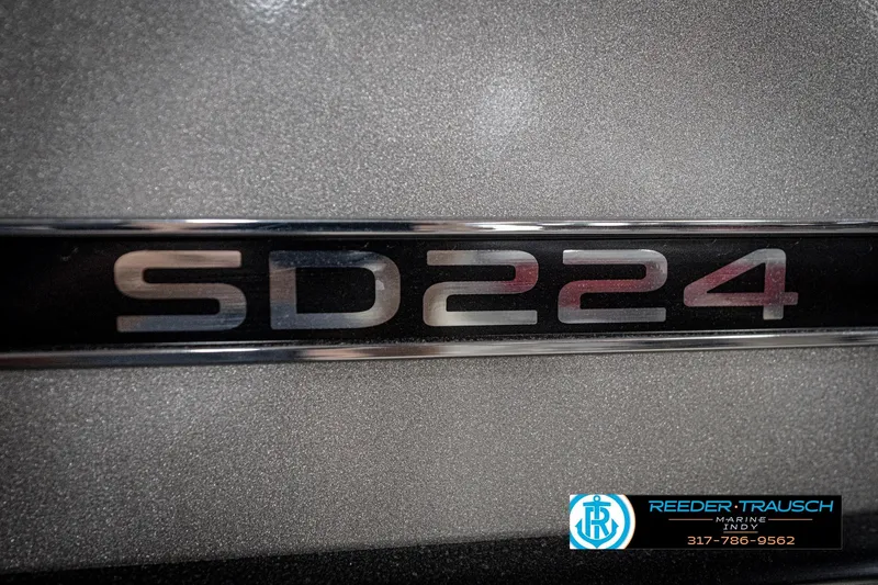 Slide: The Image of Close-up of Flowers SD224 model emblem on textured surface, 2022. - 58