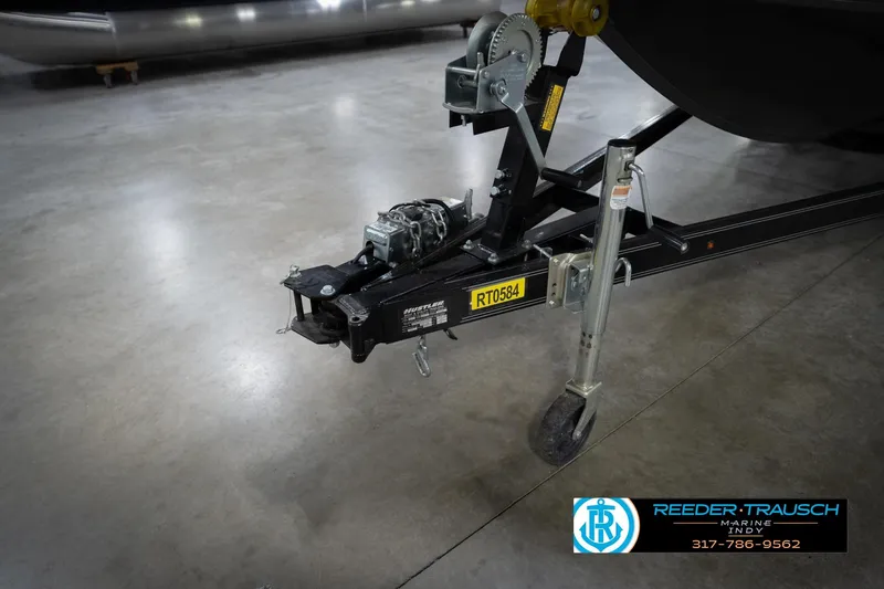 Slide: The Image of Trailer hitch with wheel and winch on concrete floor, Reeder Trausch Marine logo visible. - 61
