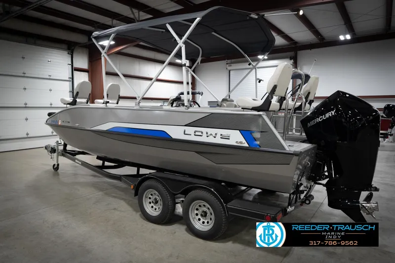 Slide: The Image of 2022 Lowe SD224 boat with Mercury engine on trailer in indoor showroom. - 8