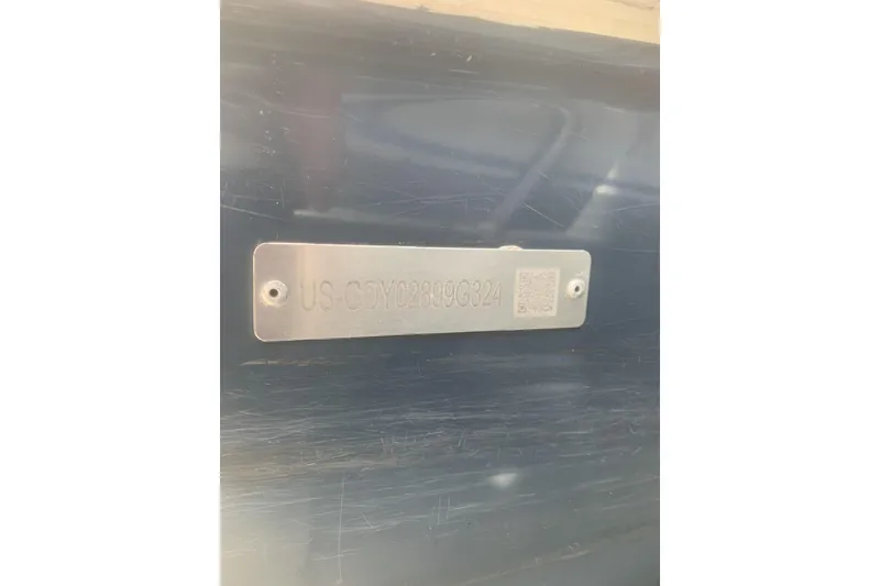 Slide: The Image of 2024 Hurricane CC231 metal identification plate with engraved serial number. - 12