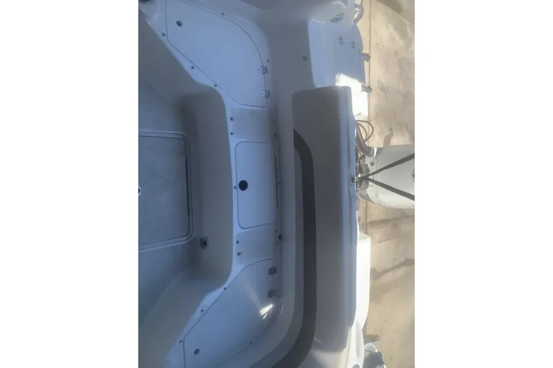 Slide: The Image of 2024 Hurricane CC231 boat interior with seating and storage compartments. - 4