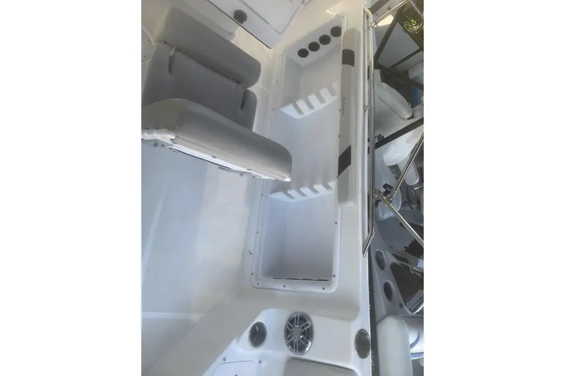 Slide: The Image of 2024 Hurricane CC231 boat interior with seating and storage compartments. - 6
