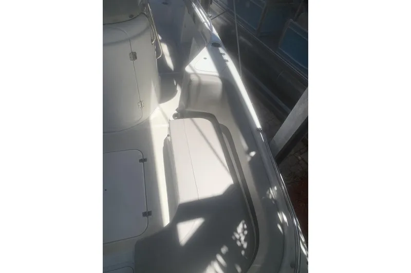 Slide: The Image of 2024 Hurricane CC231 boat interior with seating and storage compartments. - 7